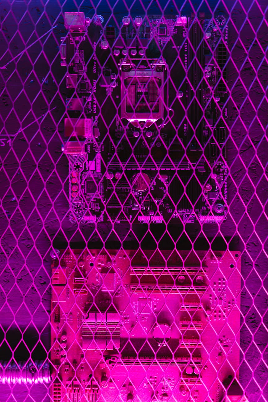 A vibrant, abstract image of a circuit board seen through a grid wire mesh, showcasing technology themes.