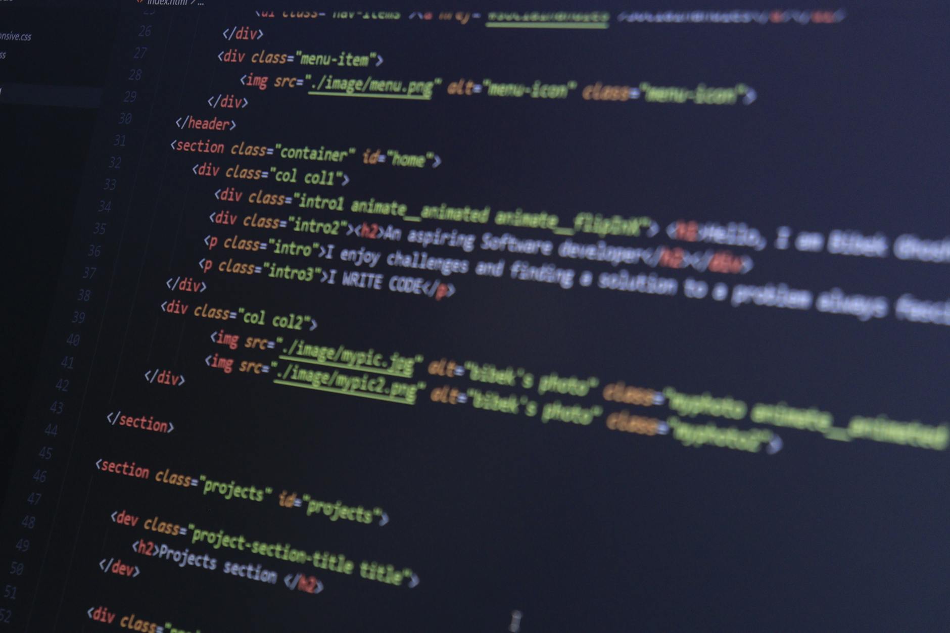 HTML and CSS code on a computer monitor, highlighting web development and programming.
